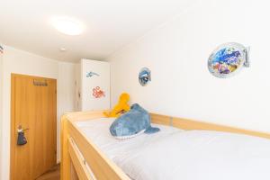 Postel nebo postele na pokoji v ubytování Cuxhaven Fewo Döse Oasis-04