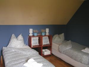 Een bed of bedden in een kamer bij B&B aandedijkinbrakel