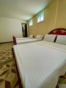 เตียงในห้องที่ Hotel Los Balcones