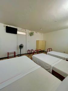 เตียงในห้องที่ Hotel Los Balcones
