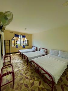 เตียงในห้องที่ Hotel Los Balcones