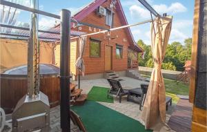 a house with a hot tub in the backyard at Gorgeous Home In Morag With Sauna in Morąg