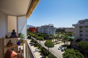 a balcony with a view of a city street at Great location! Walking distance to everything! in Fuengirola