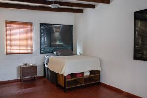 a bedroom with a bed and a table in a room at Private Miraflores core in Lima