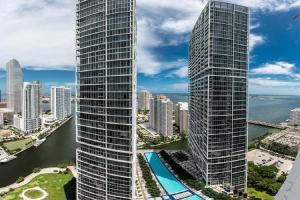 an aerial view of two tall skyscrapers in a city at Highest floor Icon W Brickell Location in Miami