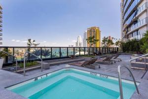 a swimming pool on the roof of a building at Holiday Holiday Circle On Cavill Apartments in Gold Coast