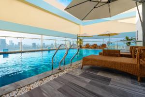 a swimming pool with a view of the city at G8 Luxury Hotel and Spa Da Nang in Da Nang