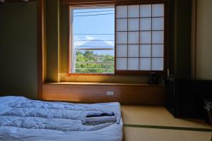 Voodi või voodid majutusasutuse Fuyo Sankyo Enka toas