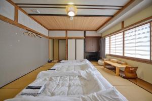 Voodi või voodid majutusasutuse Fuyo Sankyo Enka toas