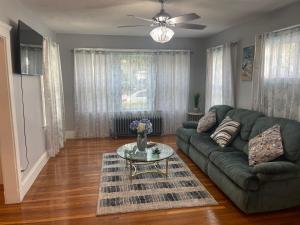 a living room with a couch and a table at Boston Luxury 2 Bedroom Private Condo in Boston