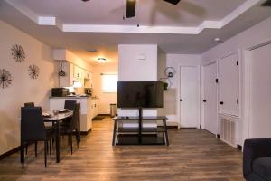 a living room with a dining table and a kitchen at Chic & Cozy 2 bedroom - 1 bathroom - RATED BEST in Eagle Pass