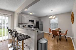 a kitchen and dining room with a table and chairs at Family-Friendly Raleigh Home, Close to Downtown in Raleigh