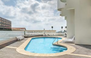 a swimming pool on the roof of a building at Luxury Sea-View Penthouse Herzliya Pituach Executive Stay in Herzliya B