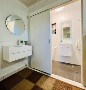 a bathroom with a sink and a mirror at Greenfields in Fernmount