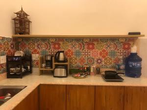 a kitchen with a counter top with a counter top at Whispering Pines Dalat (Thông Thì Thầm ĐL) in Da Lat