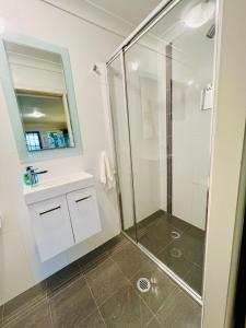 a bathroom with a shower and a sink at Greenfields in Fernmount