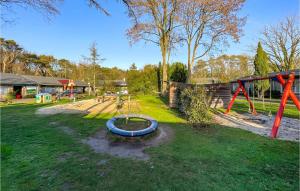 un parque infantil con un tobogán azul en Pet Friendly Home In Zuidwolde With Kitchen en Zuidwolde