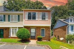 a brick house with a front door at Peace and Games with Class in Stone Mountain