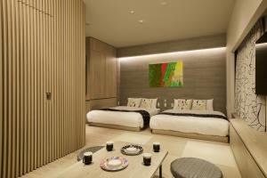 Cama ou camas em um quarto em fav HIROSHIMA HEIWAODORI