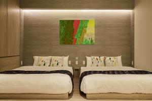 Cama ou camas em um quarto em fav HIROSHIMA HEIWAODORI