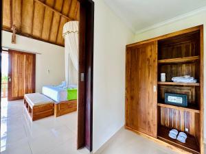 Postel nebo postele na pokoji v ubytování Green Coco Suite