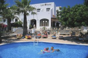 a group of people in a swimming pool at Lato hotel in Agios Nikolaos