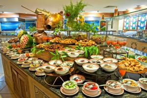 a buffet with many plates of food on a table at Charming Unit at MGM Grand STRIP Las Vegas in Las Vegas