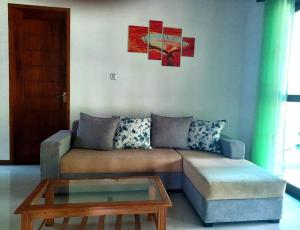a living room with a couch and a coffee table at Fully Furnished house for rent in Gampaha/Ja-ela (Colombo) in Gampaha