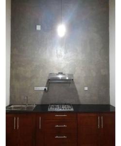 a kitchen with a stove and a sink and a light at Fully Furnished house for rent in Gampaha/Ja-ela (Colombo) in Gampaha