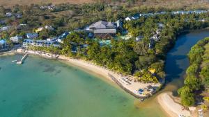 an aerial view of a resort on a beach at The Ravenala Attitude in Balaclava