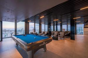 a billiard room with a pool table in a building at Luxtery Hotel & Spa in Da Nang
