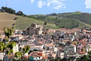 a village on the side of a hill with houses at B&B NONNA GINA in Manoppello