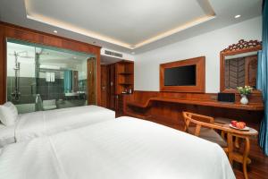 Postel nebo postele na pokoji v ubytování Monalisa Luxury Hotel