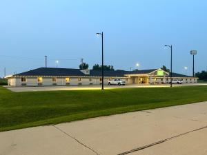 a large building with a parking lot in front of it at The Trail Inn - Atlanta, Illinois - Route 66, I-55 in Atlanta