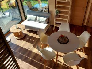 a living room with a table and chairs at Jūras dzintars in Ainaži