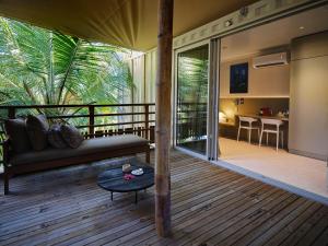 a living room with a couch and a table at Le Jardin Maore in Kani Keli