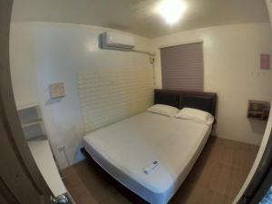 Ένα ή περισσότερα κρεβάτια σε δωμάτιο στο Entire 2 story-house in Navona Subdivision in lapu-lapu Mactan Cebu