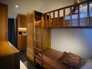 a bedroom with two bunk beds and a bed at Le Jardin Maore in Kani Keli