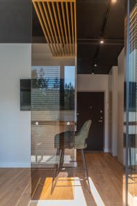Televizorius ir (arba) pramogų centras apgyvendinimo įstaigoje Green Studio apartment in Vanagupė