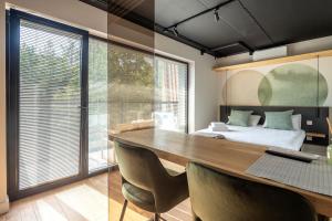 Lova arba lovos apgyvendinimo įstaigoje Green Studio apartment in Vanagupė
