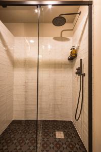 a shower with a glass door in a bathroom at K-NAT by Nuka Homes in Platja de l'Arenal +18 photos