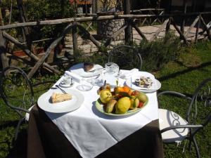 a table with a plate of fruit on it at B&B Reale in Tramonti