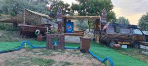 a play area with a van and a tent at CASE MOBILE (CASE IN NATURA) in Eforie Sud