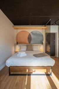 a bedroom with a bed with a glass wall at Palanga Studios in Palanga