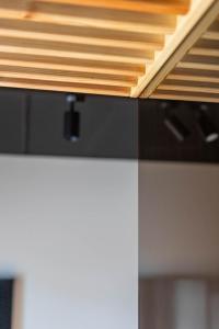 a close up of a wooden ceiling in a kitchen at Palanga Studios in Palanga