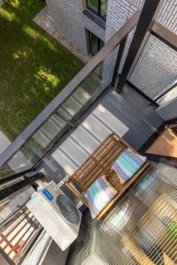 an overhead view of a table and chairs on a balcony at Palanga Studios in Palanga