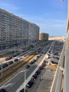 a highway filled with traffic with buildings and cars at Studio Sea View - Royal Ascot in Ostend