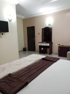 Ein Bett oder Betten in einem Zimmer der Unterkunft Gyutei Citi Hotel and Suite