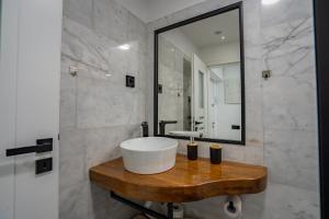 a bathroom with a large sink and a mirror at Holiday in Alba Iulia +14 photos