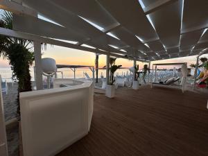 a deck on a boat with a view of the ocean at Villa Blanche Dimora Di Charme in Marsala